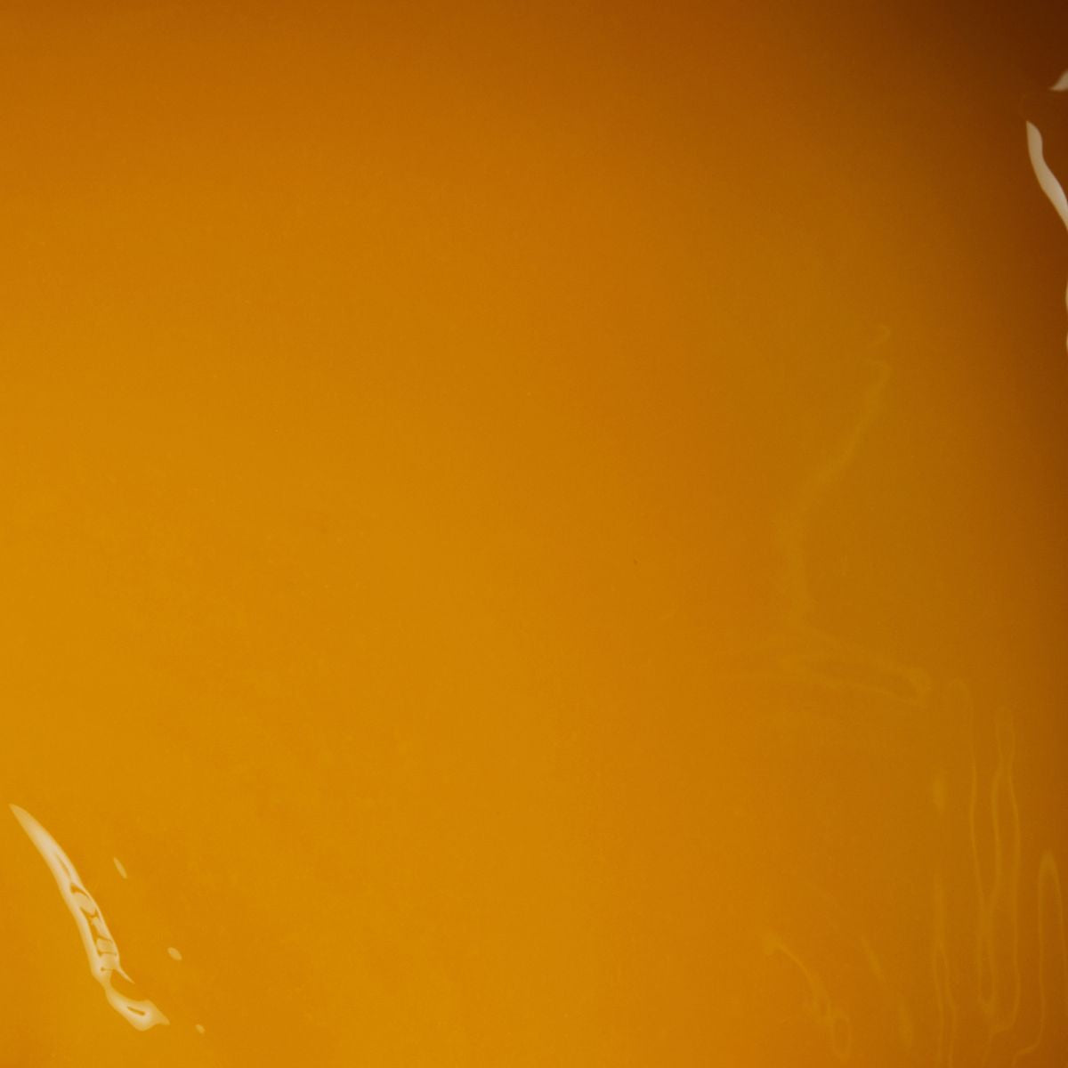 zoom sur la texture d'une purée de fruit à la mandarine Adamance